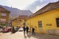 People walking on one of the main streets in the historical center of the city. The Brasov