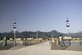 People walking onto a pier in Pietrasanta, Tuscany