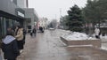 people walking outside ZUM Aichurok mall in Bishkek