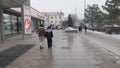 people walking outside ZUM Aichurok mall in Bishkek