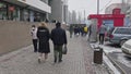 people walking outside ZUM Aichurok mall in Bishkek