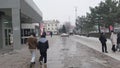 People walking outside ZUM Aichurok mall in Bishkek