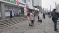 people walking outside ZUM Aichurok mall in Bishkek