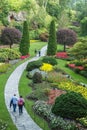 People walking through park in Butchart Gardens, Victoria, BC