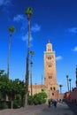 People walking in the park in front of Kotoubia Mosque in Marrakech Royalty Free Stock Photo