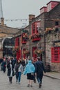 People walking past the Anchor pub in Bankside, London, UK