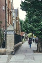People walking past The City of Westminster College campus on Elgin Avenue in London Royalty Free Stock Photo
