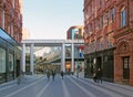 People walking past the entrance to victoria gate shopping centre in leeds, west yorkshire