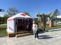 Vladivostok, Russia, September, 15, 2023.People walking past the exhibition pavilion of Buryat dolls