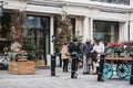 People walking past Petersham Nurseries in Covent Garden, London, UK. Royalty Free Stock Photo