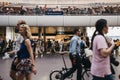 People walking past Pret A Manger cafe inside King`s Cross station, London, UK.