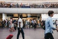 People walking past Pret A Manger cafe inside King`s Cross station, London, UK. Royalty Free Stock Photo