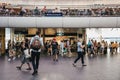 People walking past Pret A Manger cafe inside King`s Cross station, London, UK. Royalty Free Stock Photo