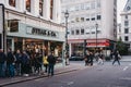 People walking past Steak & Co restaurant on the corner of Haymarket, London, UK
