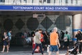 People walking past Tottenham Court Road station, London, UK.