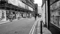 People  Walking Past A Town Centre Building Or Construction Site Development Covered By Scaffolding And Saferty Netting Royalty Free Stock Photo