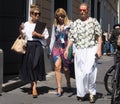 MILAN, ITALY -JUNE 18, 2018: People walking for photographers in the street after AALTO fashion show, during Milan Fashion Week Royalty Free Stock Photo