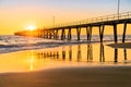 People walking on Port Noarlunga jetty at sunset Royalty Free Stock Photo