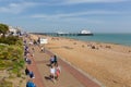 Eastbourne UK with people walking on the prom in south coast town