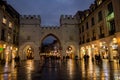 People walking during rain at night