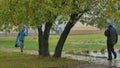 People walking in the rain with umbrellas Royalty Free Stock Photo