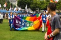 People walking with rainbow banners during gay pride