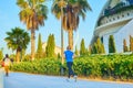 People walking and running with a mask at sunset through the River Park in the City of Arts and Sciences in Valencia Royalty Free Stock Photo