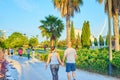 People walking and running with a mask at sunset through the River Park in the City of Arts and Sciences in Valencia Royalty Free Stock Photo