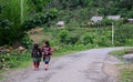 People walking on rural road in Vietnam Royalty Free Stock Photo