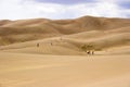 People walking in sand dunes Royalty Free Stock Photo