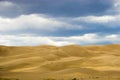 People walking in sand dunes Royalty Free Stock Photo