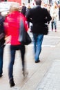 People walking on the sidewalk Royalty Free Stock Photo