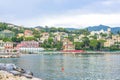 People walking on sidewalk near beach in Santa Margherita Ligure Royalty Free Stock Photo