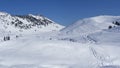 People walking or snowshoeing on mountain path with fresh snow. Feeling of freedom. Best day for mountain hikes Royalty Free Stock Photo