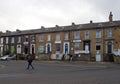 People walking on southbrook terrace ongreat horton road in bradford a run down street of mixed housing and businesses