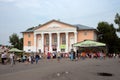 People are walking in the square in front of the House of Culture in the central square at the Intl festival `World of Siberia`