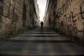 A man walking right up the long stairs Royalty Free Stock Photo