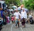 People walking on street in Bali, Indonesia Royalty Free Stock Photo