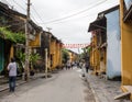 People walking on street in Hoi An, Vietnam Royalty Free Stock Photo