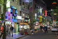 People walking at a street in Seoul at night
