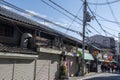 People are walking on street toward Shitennoji in Osaka Tennoji area