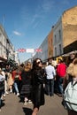 People walking on the street, visiting Portobello road market in Notting Hill, London
