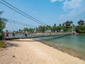 People Walking on the Suspension Bridge at Palawan Beach Singapore Royalty Free Stock Photo