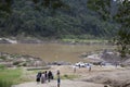 People walking to the river for a boat ride