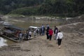 People walking to the river for a boat ride