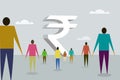 People walking towards a structure in shape of  Indian currency Rupee Royalty Free Stock Photo