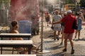 People walking under misting system to cool off during heatwave Royalty Free Stock Photo