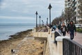 People walking up and down the promenade of the Sliema waterfront in Malta