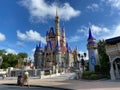 People walking up to Cinderella`s Castle in the Magic Kingdom at  Walt Disney World Resorts in Orlando, FL Royalty Free Stock Photo