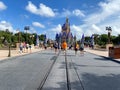 People walking up to Cinderella`s Castle in the Magic Kingdom at  Walt Disney World Resorts in Orlando, FL Royalty Free Stock Photo